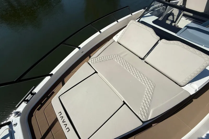 Slide: The Image of 2026 Navan S30 boat with luxurious beige seating and sleek design. - 28
