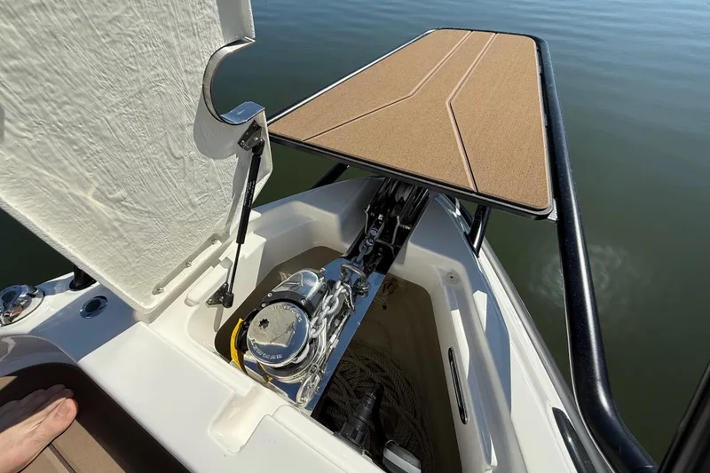 Slide: The Image of Anchor compartment of 2026 Navan S30 boat with open hatch and visible winch. - 30