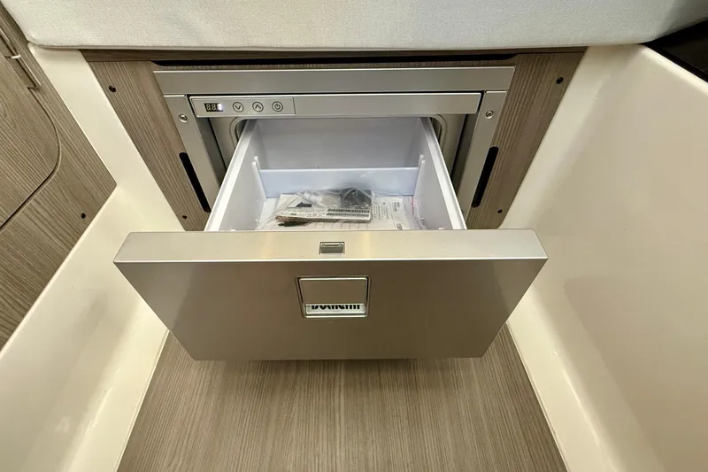 Slide: The Image of Open drawer in Navan S30, 2026 model, showcasing sleek interior design and storage space. - 33