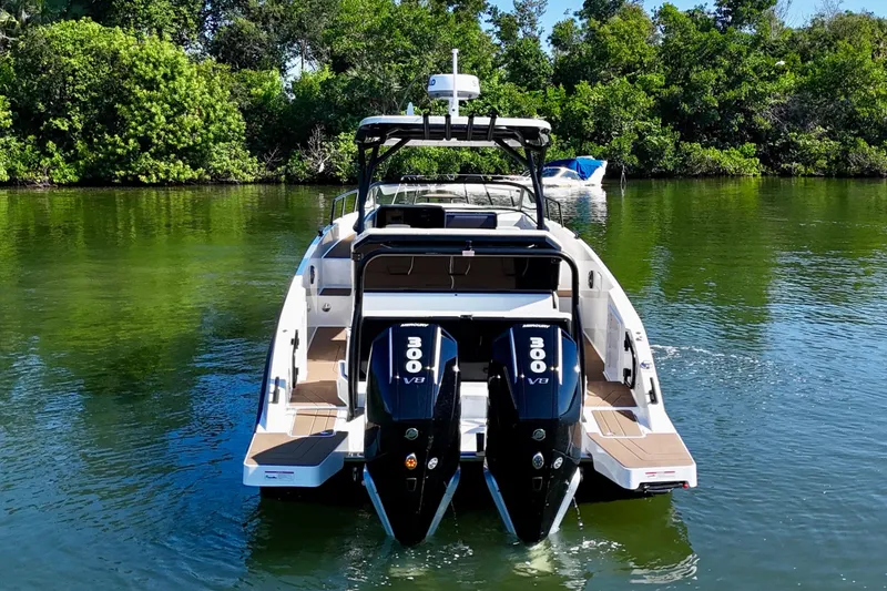 Slide: The Image of 2026 Navan S30 boat with dual 300 V8 engines on a serene waterway. - 7