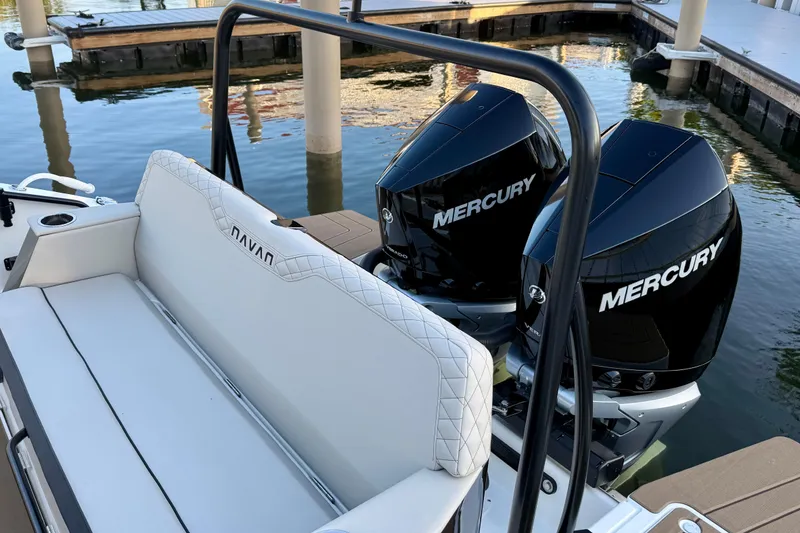 Slide: The Image of 2026 Navan S30 boat with dual Mercury outboard engines at a dock. - 9