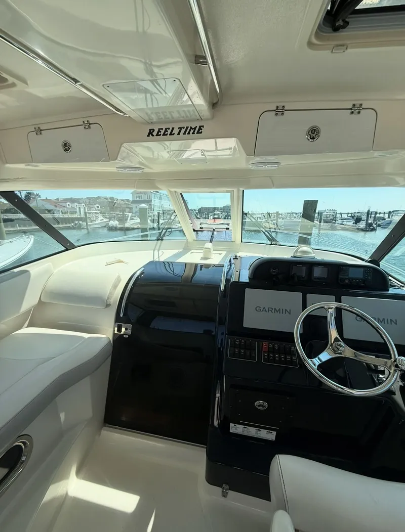 Slide: The Image of 2014 Pursuit OS 345 Offshore boat in harbor. - 1