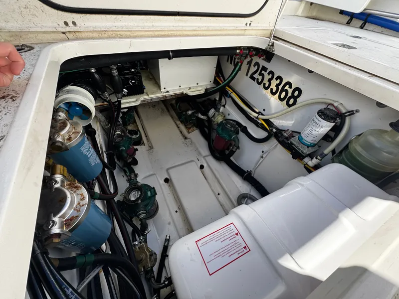 Slide: The Image of Engine compartment of a 2014 Pursuit OS 345 Offshore boat. - 19