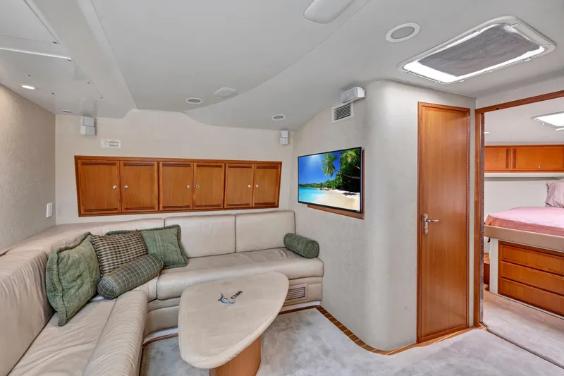 Slide: The Image of Luxurious interior of 2010 Cabo 45 Express yacht with cozy seating and modern amenities. - 20