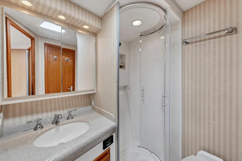 Slide: The Image of Luxurious bathroom in 2010 Cabo 45 Express yacht with modern fixtures and shower. - 29