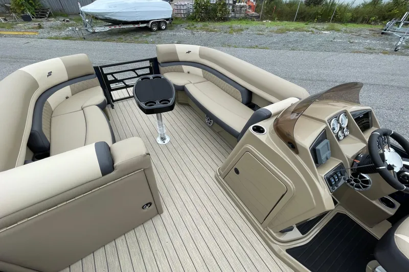 Slide: The Image of Interior of 2026 Starcraft EXS 5 Q DH boat with modern helm and seating. - 10