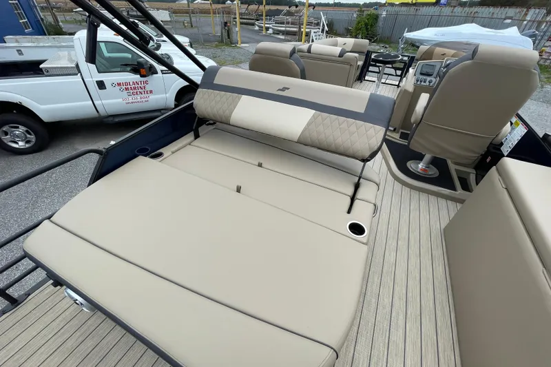 Slide: The Image of 2026 Starcraft EXS 5 Q DH boat interior with beige seating and modern dashboard. - 15