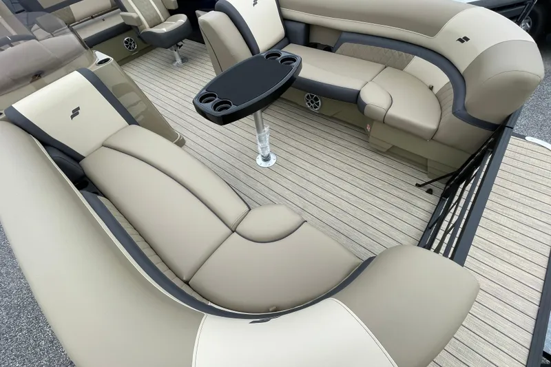 Slide: The Image of Luxurious interior of 2026 Starcraft EXS 5 Q DH pontoon boat with plush seating. - 7