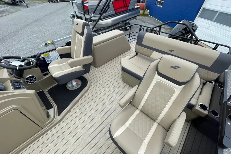 Slide: The Image of 2026 Starcraft EXS 5 Q DH pontoon boat with spacious seating and modern dashboard. - 9