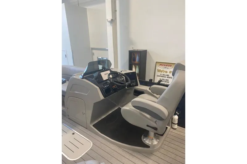 Slide: The Image of 2026 Bentley Pontoons Elite 223 Swingback helm with modern controls and comfortable seating. - 19