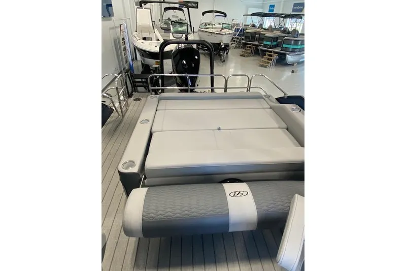 Slide: The Image of 2026 Bentley Pontoons Elite 223 Swingback with spacious seating in showroom. - 25