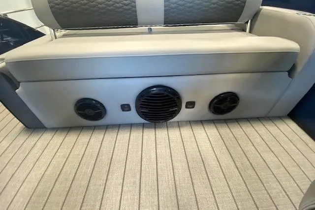 Slide: The Image of Bentley Pontoons Elite 223 Swingback 2026 interior with speaker system and cushioned seating. - 27