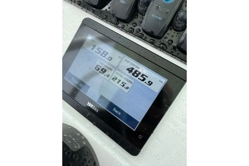 Slide: The Image of Yamaha display on 2022 Sea Hunt Ultra 234 showing trip data and hours. - 24