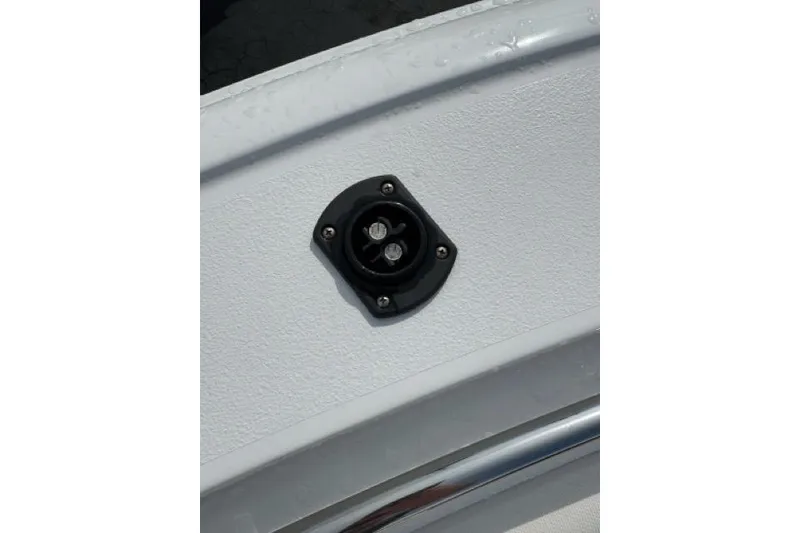 Slide: The Image of Close-up of a 2022 Sea Hunt Ultra 234 boat detail, featuring a mounted fixture. - 25