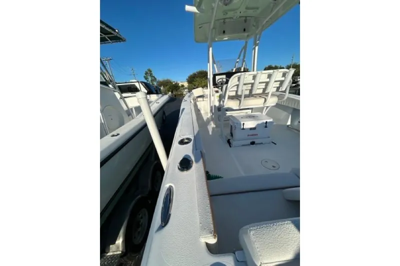 Slide: The Image of 2022 Sea Hunt Ultra 234 boat stern with trim tab and Coosa board label. - 3