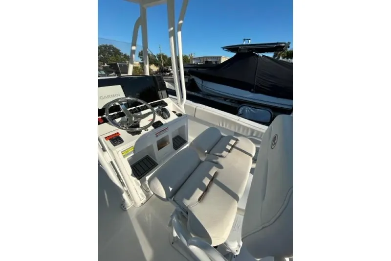 Slide: The Image of 2022 Sea Hunt Ultra 234 boat interior with Yeti cooler under seat. - 7