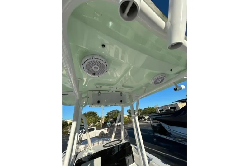Slide: The Image of 2022 Sea Hunt Ultra 234 boat interior with steering wheel and seating. - 8