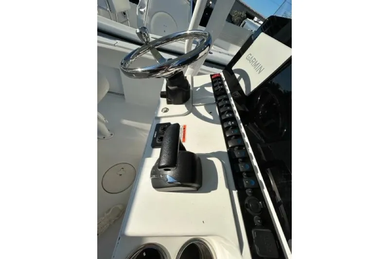 Slide: The Image of 2022 Sea Hunt Ultra 234 boat interior with speakers and rod holders. - 9