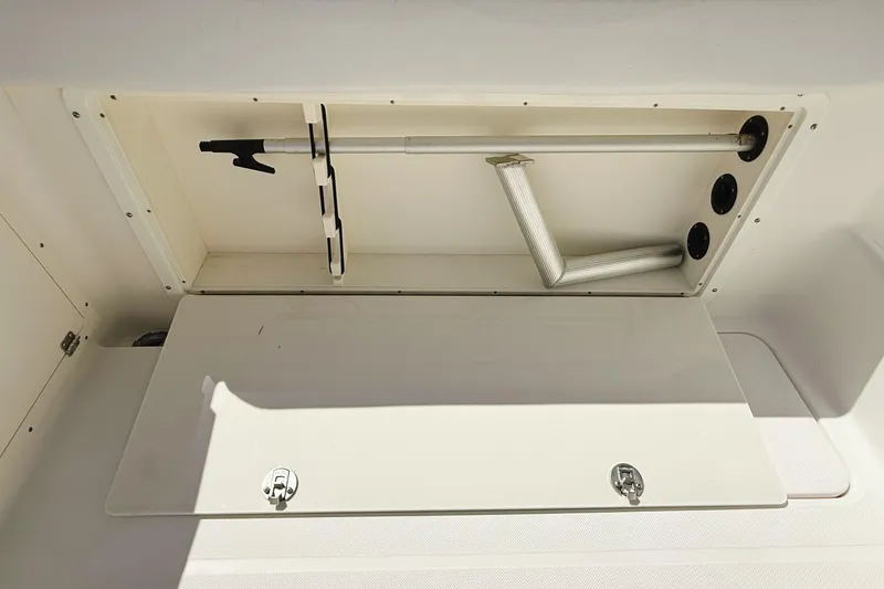 Slide: The Image of Storage compartment in 2016 Century 2600 Walkaround boat, featuring organized equipment and secure latches. - 10