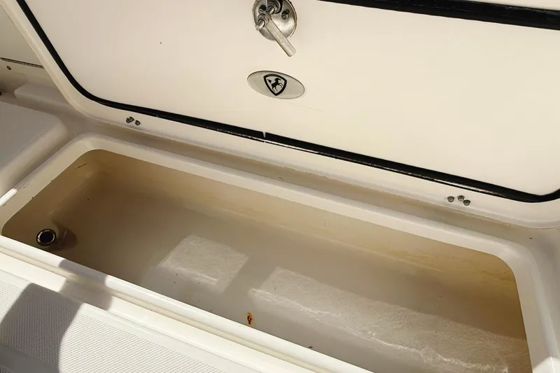 Slide: The Image of Open storage compartment on a 2016 Century 2600 Walkaround boat. - 12