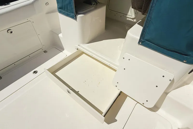 Slide: The Image of 2016 Century 2600 Walkaround boat interior with open storage compartment. - 13
