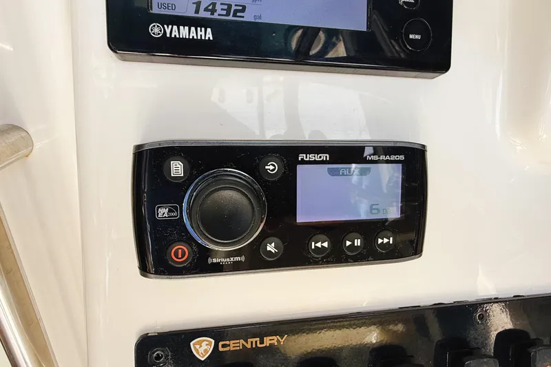 Slide: The Image of Control panel of a 2016 Century 2600 Walkaround boat with Yamaha and Fusion systems. - 14