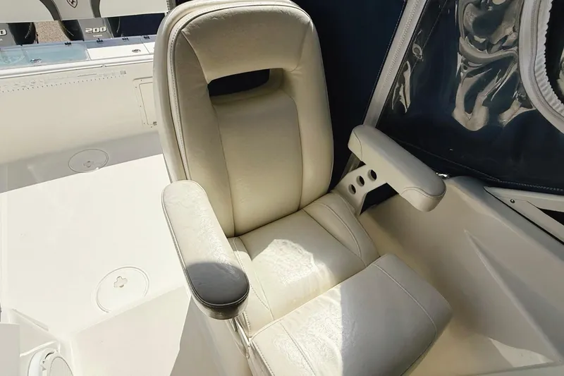 Slide: The Image of Comfortable captain's chair on 2016 Century 2600 Walkaround boat, featuring plush upholstery. - 20