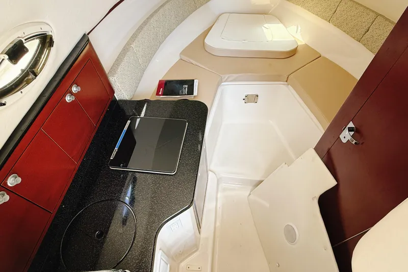 Slide: The Image of 2016 Century 2600 Walkaround cabin interior with kitchenette and seating area. - 23