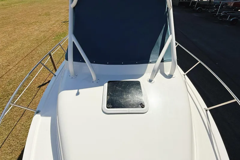 Slide: The Image of 2016 Century 2600 Walkaround boat deck with hatch and railing. - 29