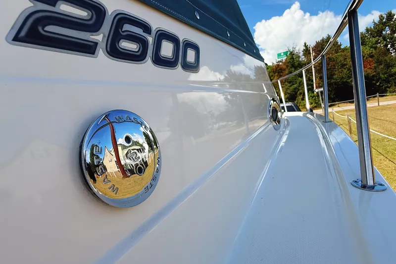 Slide: The Image of 2016 Century 2600 Walkaround boat, side view with waste cap and railing. - 30