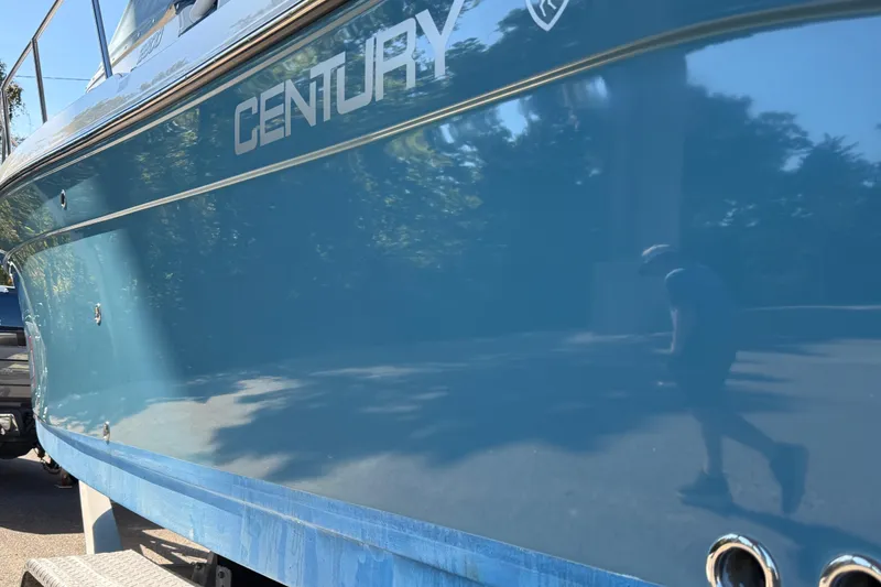 Slide: The Image of 2016 Century 2600 Walkaround boat with shiny blue hull and logo. - 31