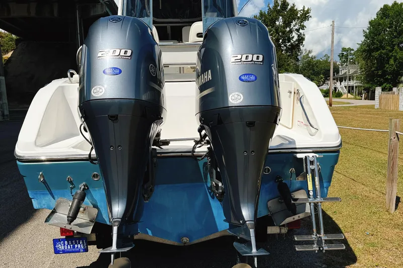 Slide: The Image of 2016 Century 2600 Walkaround with dual Yamaha 200 engines, parked outdoors. - 33