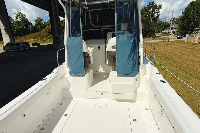 Slide: The Image of 2016 Century 2600 Walkaround boat with spacious deck and seating area. - 5
