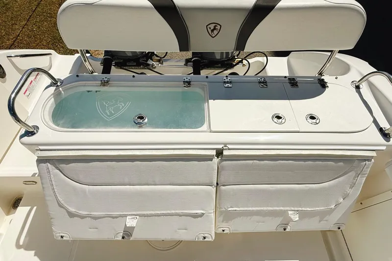 Slide: The Image of Century 2600 Walkaround 2016 boat interior with livewell and storage compartments. - 7