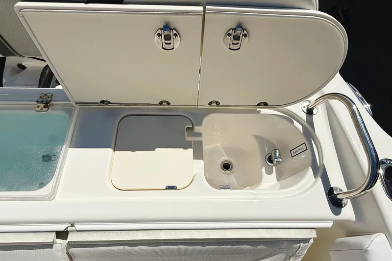 Slide: The Image of Century 2600 Walkaround 2016 boat sink and storage compartment. - 8