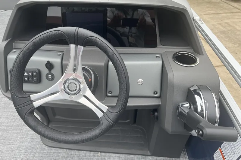 Slide: The Image of Steering console of 2026 Sun Tracker SportFish 20 DLX pontoon boat. - 7