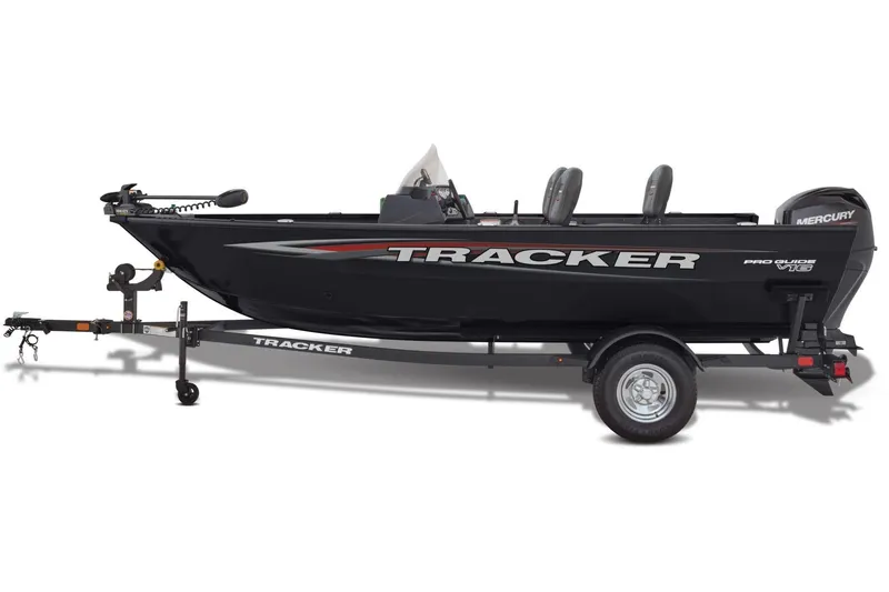 Slide: The Image of 2026 Tracker Pro Guide V-16 SC boat interior with carpeted deck and storage compartments. - 4