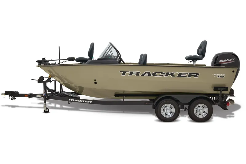 Slide: The Image of 2026 Tracker Targa V-18 Combo boat with fishing gear, parked outdoors. - 4