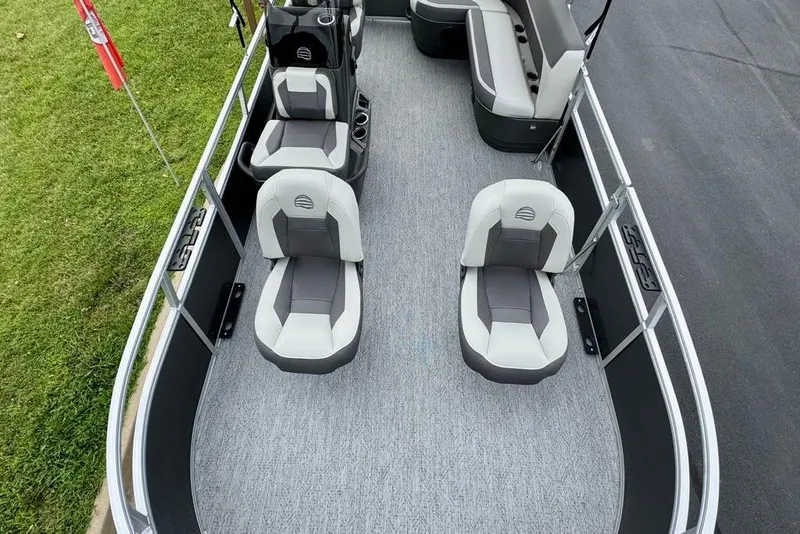 Slide: The Image of 2026 Sun Tracker Bass Buggy 16 XL Select pontoon boat with Mercury engine on trailer. - 8