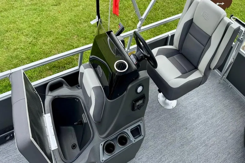 Slide: The Image of 2026 Sun Tracker Bass Buggy 16 XL Select interior with captain's chair and console. - 84