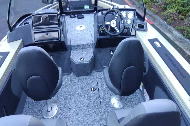 Slide: The Image of 2026 Tracker Targa V-19 Combo boat interior with dual seats and modern dashboard. - 6
