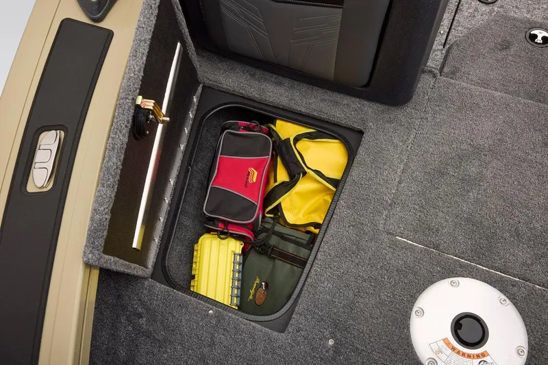Slide: The Image of 2026 Tracker Targa V-18 Combo boat storage compartments with secure latches. - 18