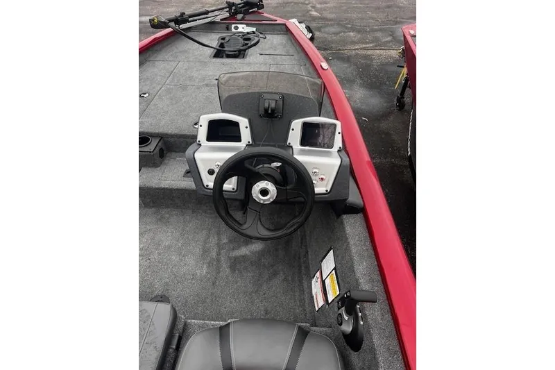 Slide: The Image of 2026 Tracker Pro Guide V-175 WT boat interior with steering wheel and control panel. - 64