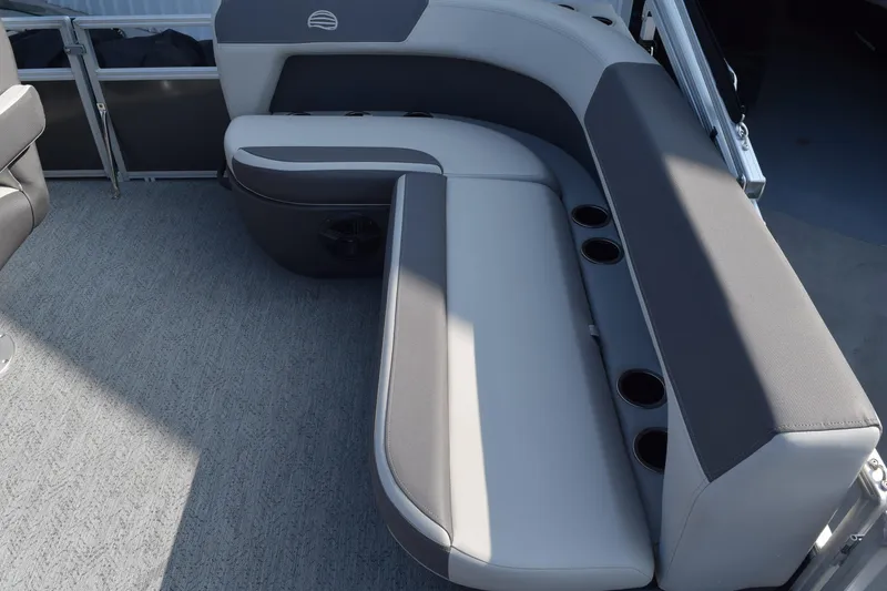 Slide: The Image of 2026 Sun Tracker Bass Buggy 16 XL Select boat interior with cushioned seating and cup holders. - 8