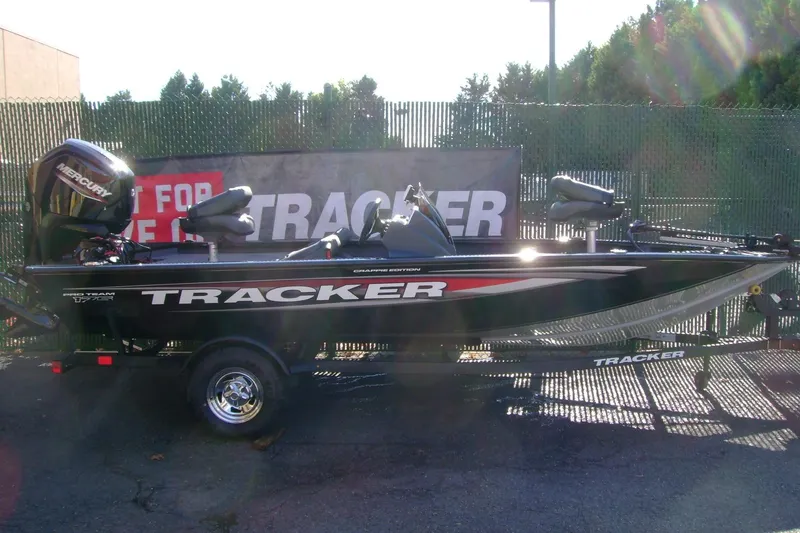The Image of 2026 Tracker Pro Team 175 Crappie Edition boat with Mercury engine, parked outdoors. - 0