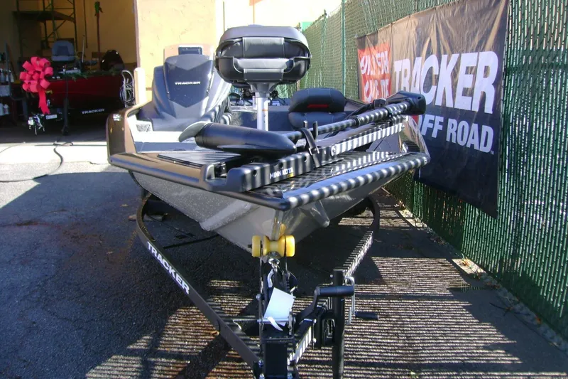 Slide: The Image of 2026 Tracker Pro Team 175 Crappie Edition boat on trailer, displayed outdoors. - 3