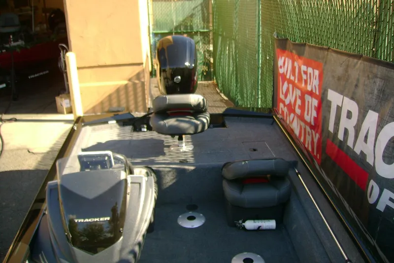 Slide: The Image of 2026 Tracker Pro Team 175 Crappie Edition boat interior with seating and equipment. - 5