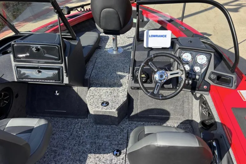 Slide: The Image of 2026 Tracker Targa V-19 Combo boat interior with steering wheel and navigation system. - 13