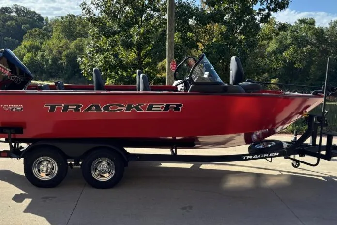 Slide: The Image of 2026 Tracker Targa V-19 Combo boat on trailer, parked outdoors. - 9