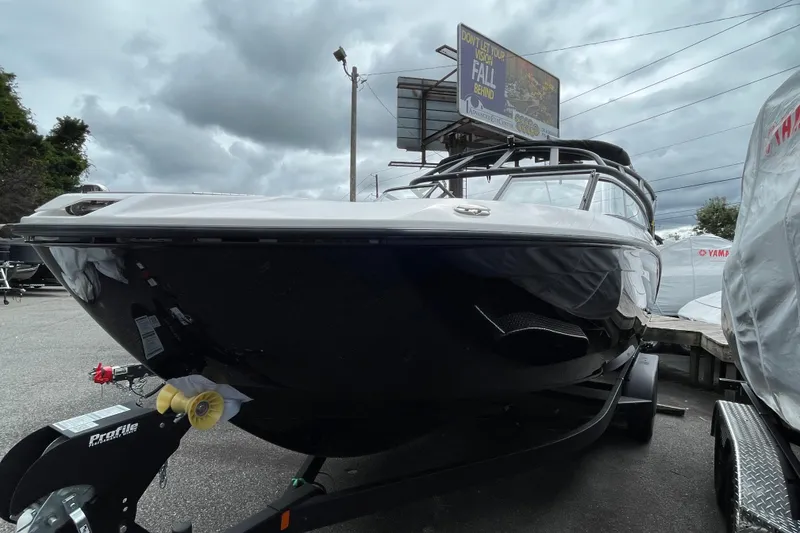 Slide: The Image of 2026 Yamaha AR250 boat on trailer under cloudy sky. - 3
